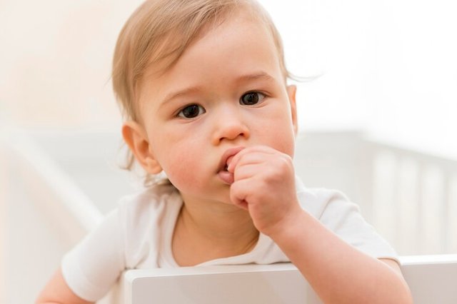 portrait-baby-crib_23-2148552462.jpg