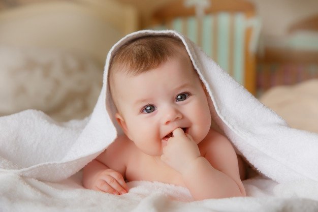 happy-smiling-baby-towel-after-bathing_106368-652.jpg