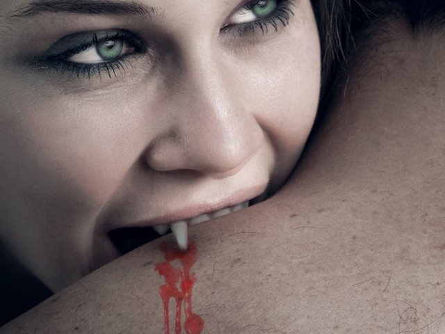 love_and_blood_-_vampire_woman_biting_her_lover.jpg