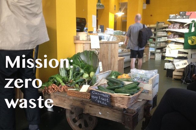 Man in shop and veg cart cropped text.jpg