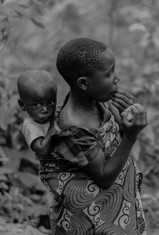 free-photo-of-boy-carrying-brother-in-black-and-white.jpeg