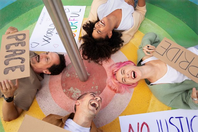 close-up-happy-people-with-placards.jpg