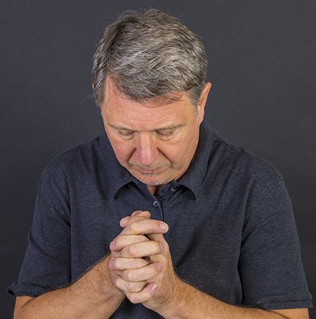 middle-age-man-praying-111236825.jpg