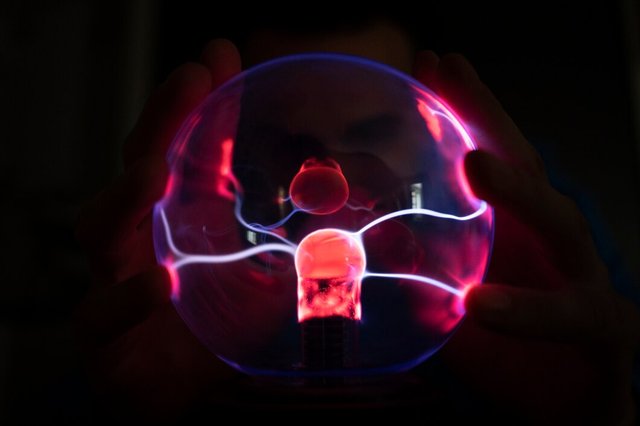 front-view-hands-interacting-with-plasma-ball_23-2150572268.jpg