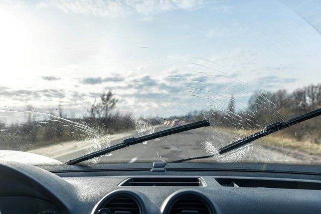 car-wipers-clean-windshields-when-driving-sunny-weather.jpg