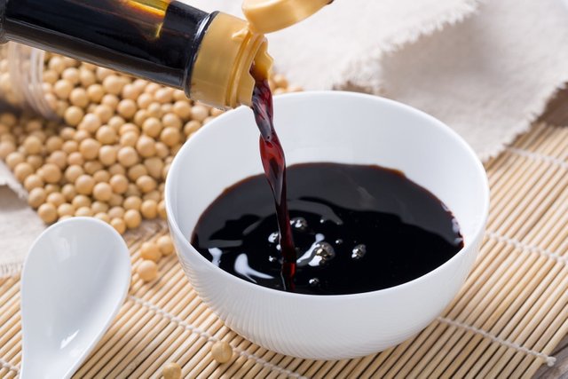 pouring-soy-sauce-into-a-white-bowl.jpg