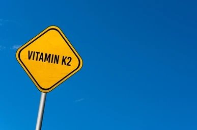 vitamin-k2-yellow-sign-blue-260nw-1095494552_1.webp