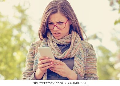 woman-looking-angry-phone-260nw-740680381.jpg