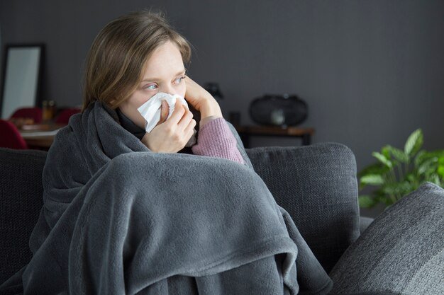 bored-sick-woman-holding-hand-head-blowing-nose-with-napkin_1262-18377.jpg