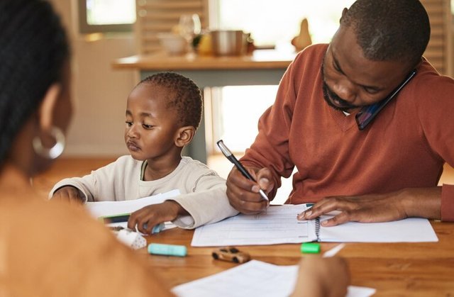 busy-multitasking-father-talking-call-while-taking-care-his-child-home-african-american-entrepreneur-freelancer-analyzing-paperwork-with-his-wife-caring-his-busy-little-son_590464-78145.jpg