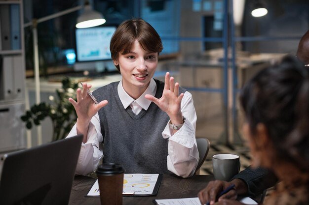 young-businesswoman-talking-gesturing-while-sitting-table-meeting-giving-recommendations-employees-office_249974-10873.jpg