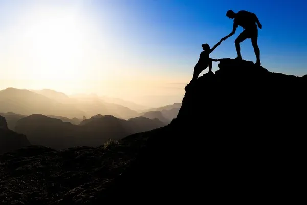 depositphotos_73145419-stock-photo-teamwork-couple-hiking-helping-hand.jpg