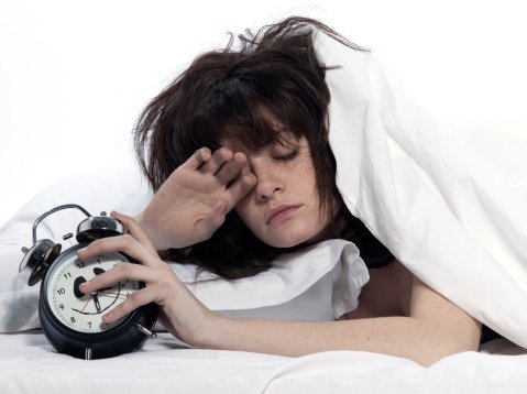 9-18-12-woman-in-bed-awakening-alarm-clock.jpg