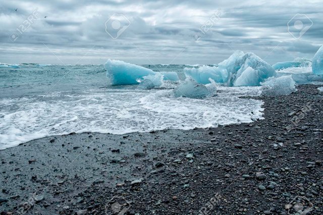 82929952-chunks-of-ice-from-the-glacial-lagoon-in-iceland-on-a-black-volcanic-ash-beach-ice-is-slowly-melting.jpg
