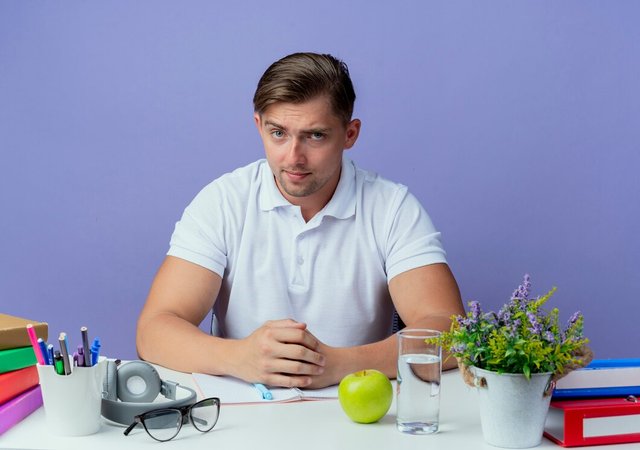 looking-young-handsome-male-student-sitting-desk_141793-98769.jpg