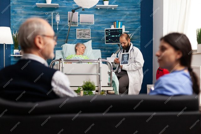 caregiver-man-doctor-worker-explaining-radiography-discussing-disease-treatment-with-sick-retired-senior-woman-social-services-nursing-elderly-retired-female-healthcare-assistance_482257-16469.jpg