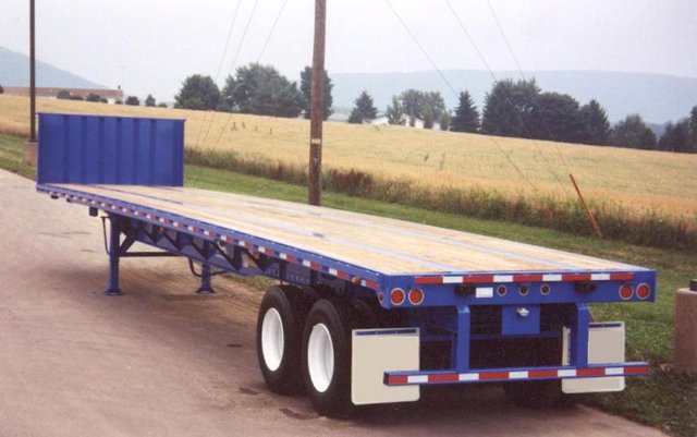 steel-flatbed-trailers-flatbed-with-closed-tandem-axles-and-bulkhead.jpg