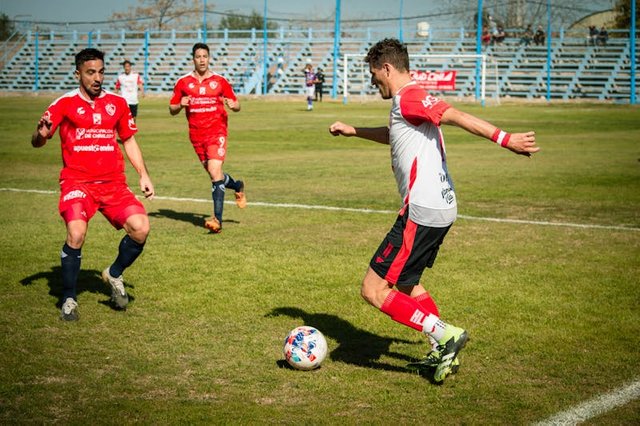 free-photo-of-a-soccer-player-is-kicking-the-ball.jpeg