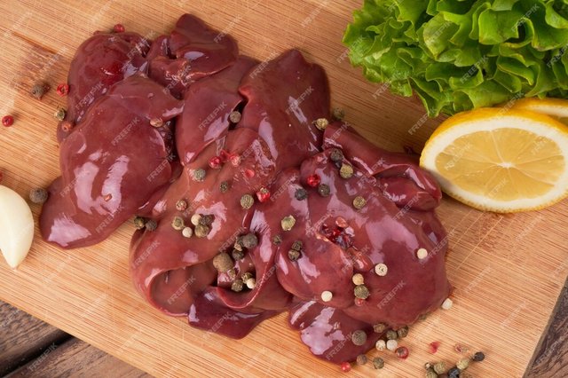 raw-chicken-liver-wooden-board-beautifully-served-with-pepper-lemon-herbs_154092-4446.jpg