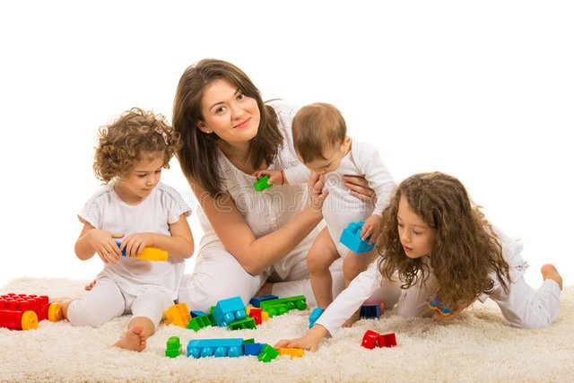 beauty-mom-playing-her-kids-home-sitting-together-fur-carpet-39086191.jpg