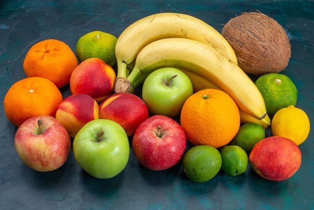 front-view-different-fruit-composition-bananas-tangerines-apples-dark-blue-desk-fruit-fresh-mellow-ripe-color-vitamine_140725-53054.jpg