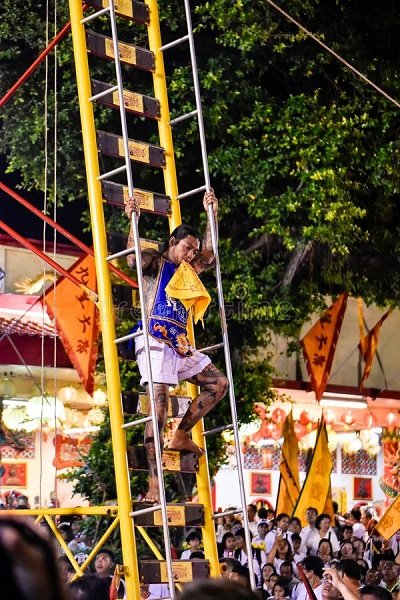 climb-ladder-knife-phuket-vegetarian-festival-phuket-thailand-october-unidentified-devotee-chinese-gods-climb-129511645.jpg