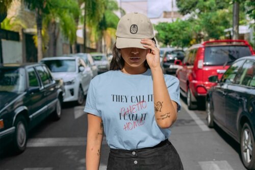 mockup-of-a-woman-standing-in-the-street-wearing-a-t-shirt-and-a-dad-hat-28608.jpg