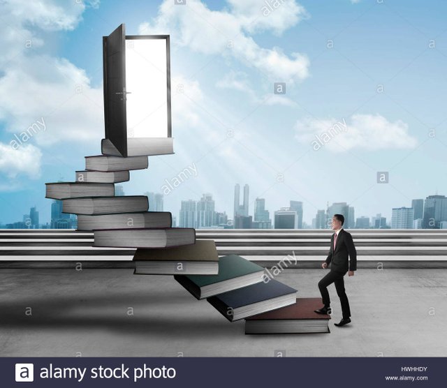 asian-business-man-stepping-up-stair-made-from-book-business-knowledge-HWHHDY.jpg