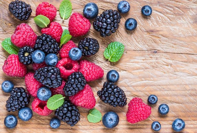 A variety of berries on a board