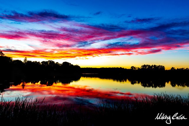 Ell Pond is located in New England - Melrose Massachusetts. The pond offers stunning photo opportunities for sunsets.