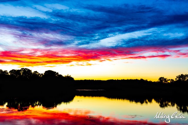 Ell Pond is located in New England - Melrose Massachusetts. The pond offers stunning photo opportunities for sunsets.