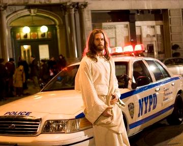 Jesus leans on cop car