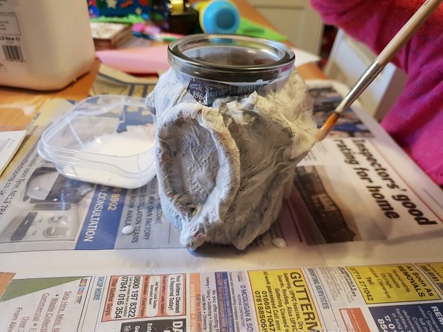 building up the paper mache layers 