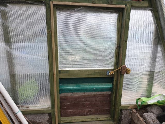framing out the greenhouse door