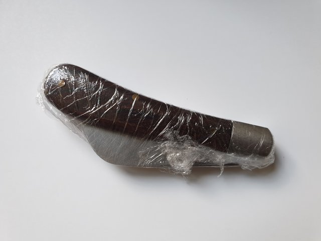 knife covered in cling film