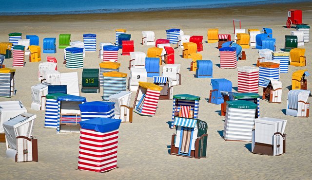 a lot of hooded beach chairs