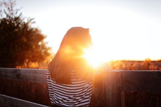 rearviewofwomanstandinginbalconyduringsunset325520.jpg