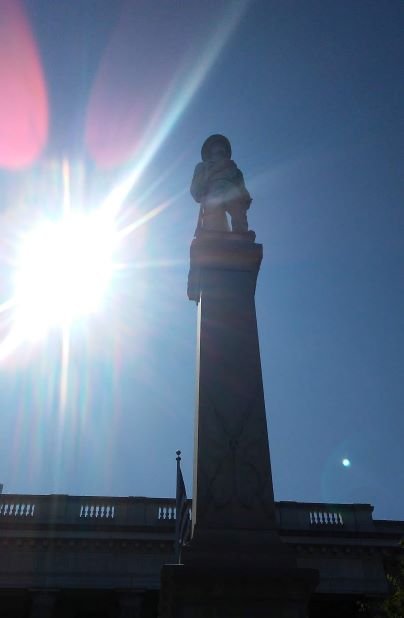 statue silhouette sunburst.jpg