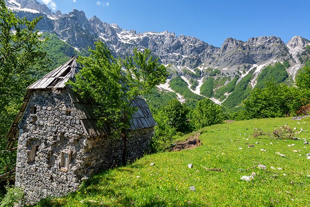 albania_valbona_stone_building_and_mountains_reduced1.jpg