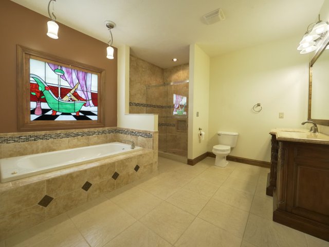 Stained glass in the master bath. Real estate photography in Oregonia, Ohio.