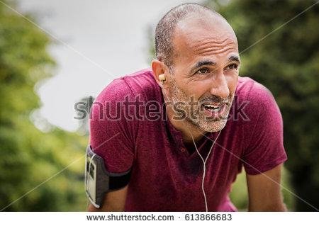 stock-photo-portrait-of-athletic-mature-man-after-run-handsome-senior-man-resting-after-jog-at-the-park-on-a-613866683.jpg