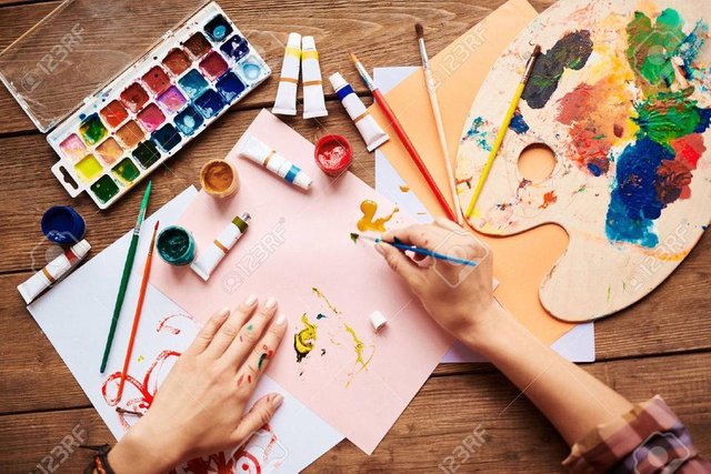 48791541-artist-painting-with-water-colors.jpg