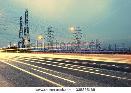 stock-photo-high-voltage-post-high-voltage-tower-sky-background-besides-the-highway-335825168.jpg