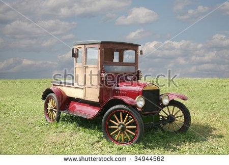 stock-photo-the-ancient-car-of-red-color-with-wooden-wheels-34944562.jpg