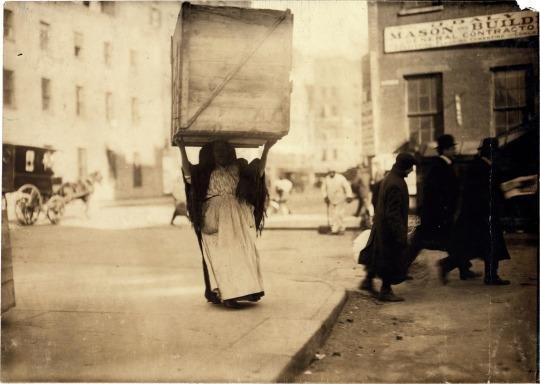 An-Italian-woman-carrying-enormous-dry-goods-box-New-York-1912..jpg