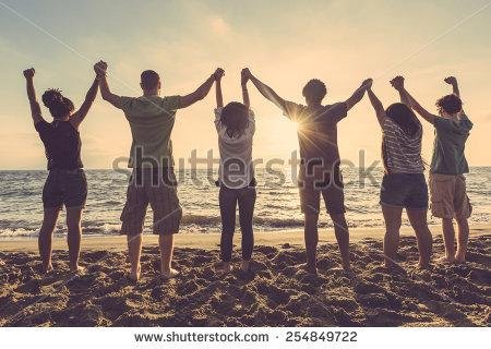 stock-photo-multiracial-group-of-people-with-raised-arms-looking-at-sunset-backlight-shot-happiness-success-254849722.jpg