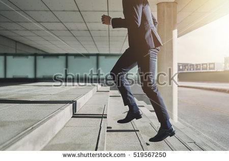 stock-photo-businessman-running-fast-upstairs-horizontal-outdoors-shot-519567250.jpg