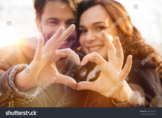 stock-photo-closeup-of-couple-making-heart-shape-with-hands-304744727.jpg