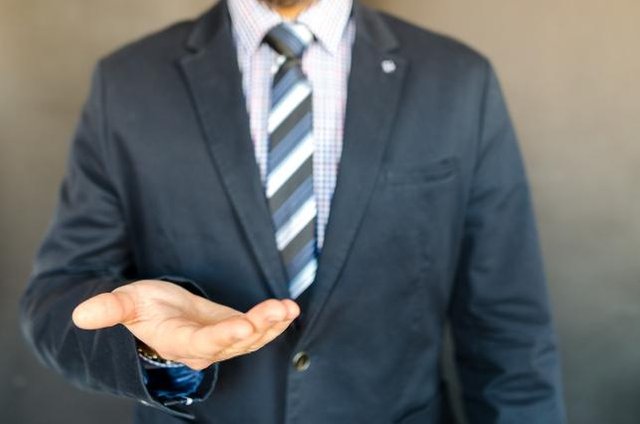man-suit-tie-hand-extended600x400.jpeg