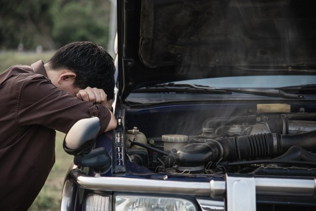 man-try-fix-car-engine-problem-local-road (3) (1)